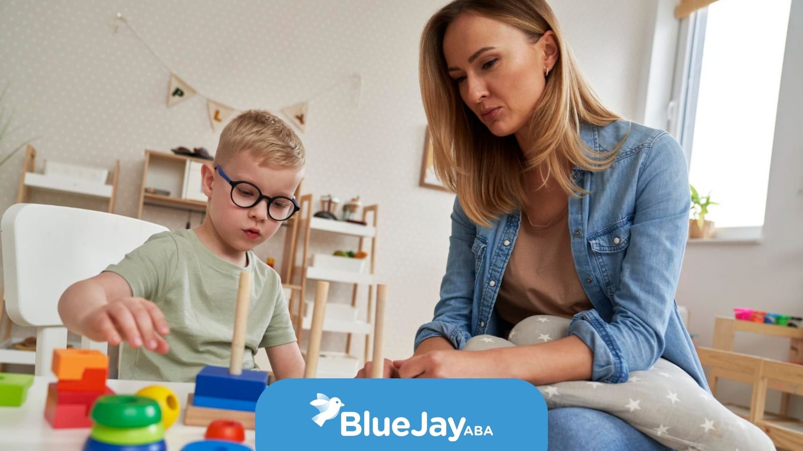 BCBA providing ABA therapy to a young child with autism.