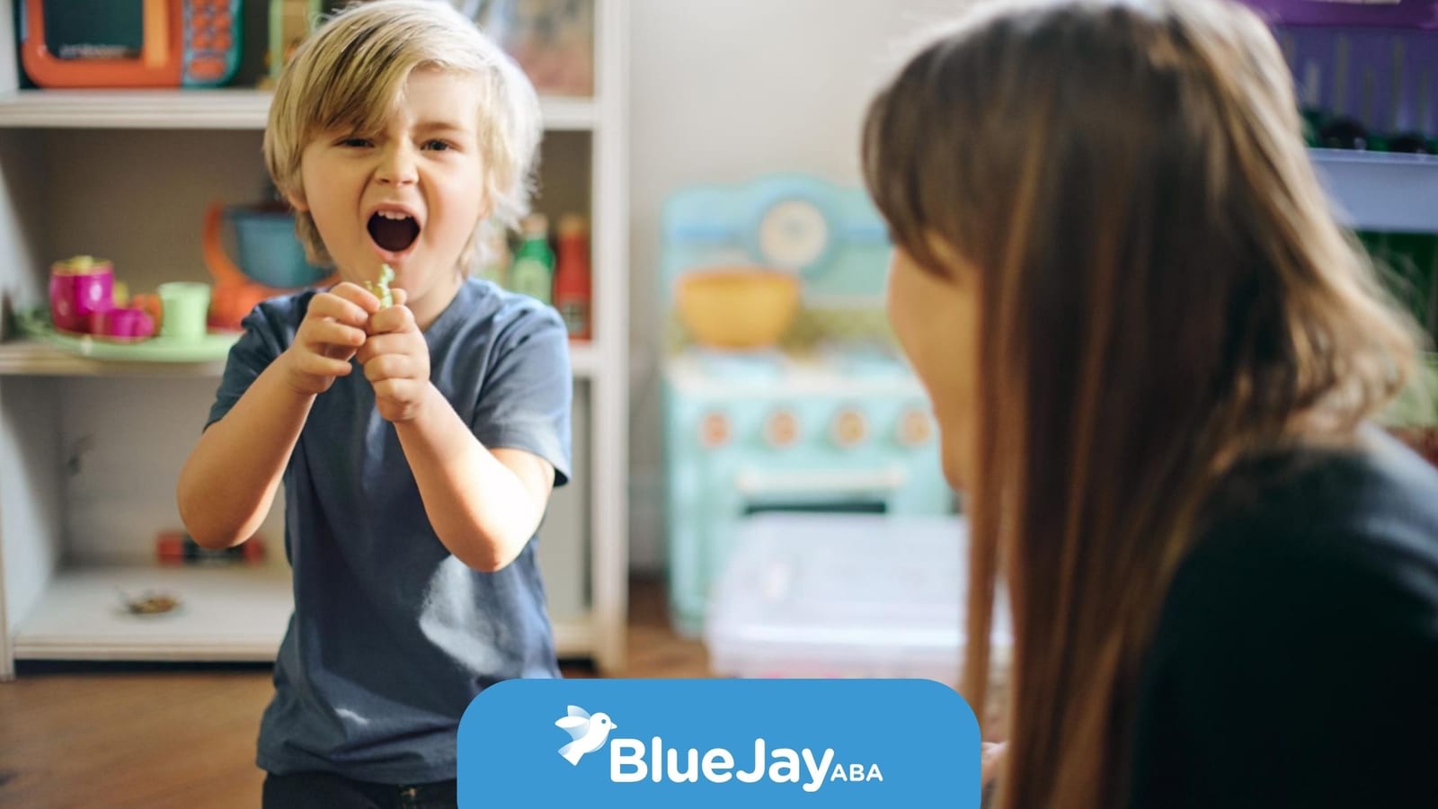 Young boy playing with a toy during an ABA therapy session.