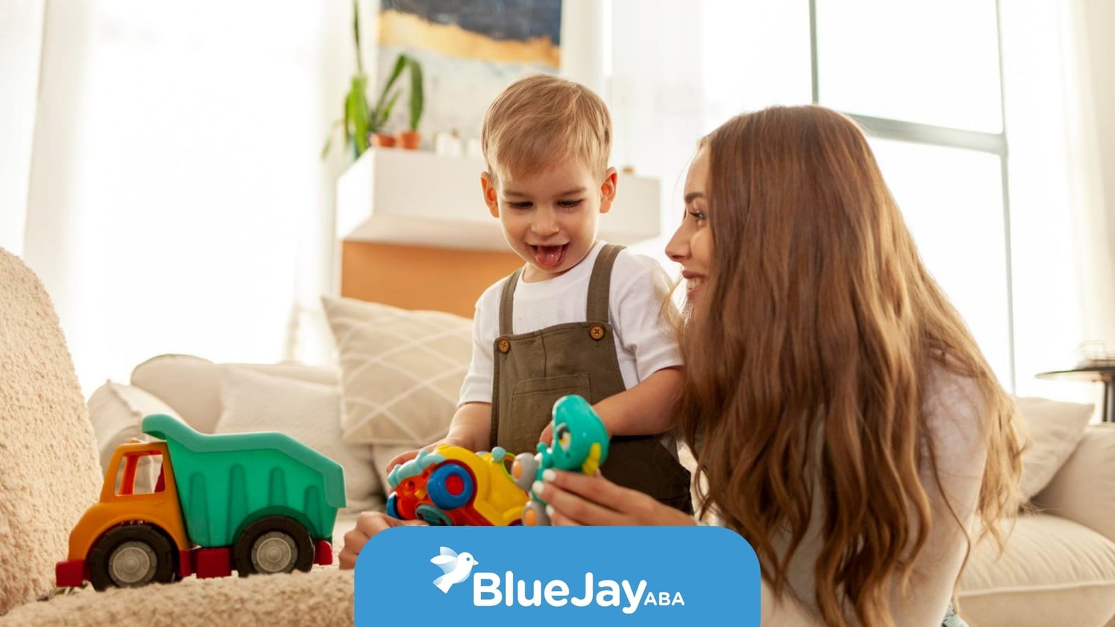 Young autistic child playing with toys at home with a caregiver.
